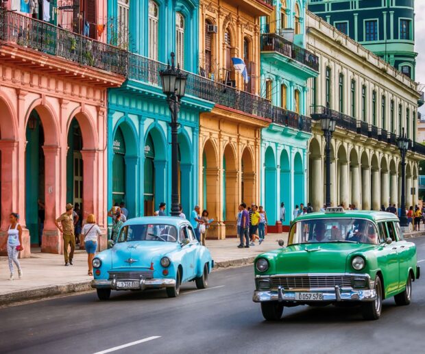 The Havana Cuba Wallpapers show classic cars driving past vibrant colonial buildings on a lively street, HD Desktop Wallpaper