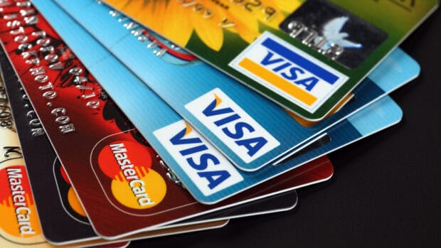 A close up of colorful credit cards showing Mastercard and Visa logos in a neat pile, 2K Desktop Wallpaper