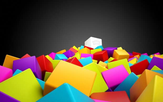 A vibrant pile of colorful cubes with one white cube showing a crown symbol, HD Desktop Wallpaper