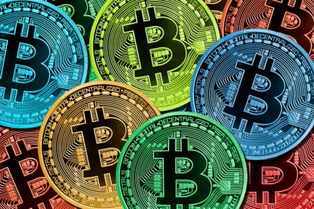 Colorful digital bitcoins with intricate circuit details in various shades, HD Desktop Wallpaper