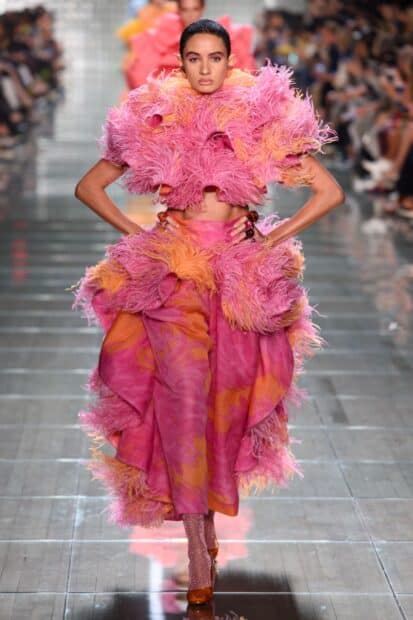 A model showcases a colorful and textured outfit by Marc Jacobs on the runway, 2K Desktop Wallpaper