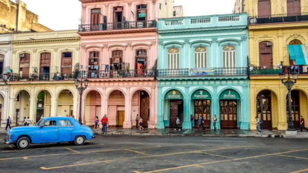 A street with pastel colors and a vintage blue car in Havana Cuba, 4K Desktop Wallpaper