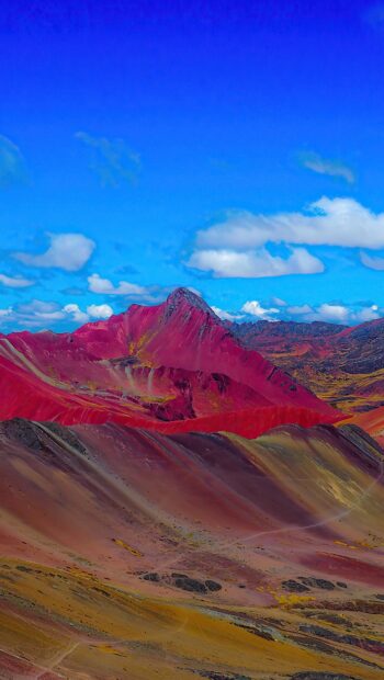 A vibrant mountain landscape with red and yellow hues under a bright blue sky represents Peru wallpapers, HD Phone Wallpaper