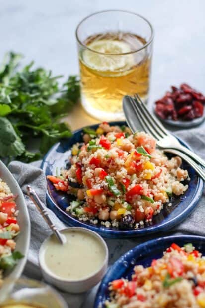 A vibrant quinoa salad with chickpeas and peppers served on a blue plate, HD Mobile Wallpaper