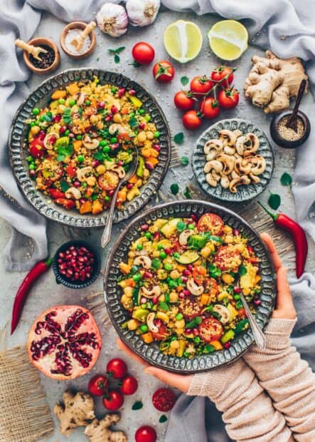 A vibrant quinoa salad with chickpeas, tomatoes, and cashews served on a plate, HD Mobile Wallpaper