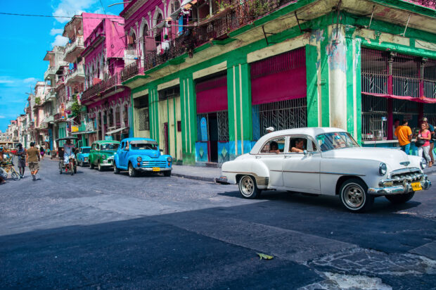 A street in Havana Cuba with vintage cars and colorful buildings, 2K Desktop Wallpaper