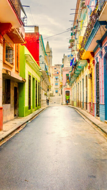 A vibrant street lined with colorful buildings captures the charm of Havana Cuba Wallpapers, HD Mobile Wallpaper