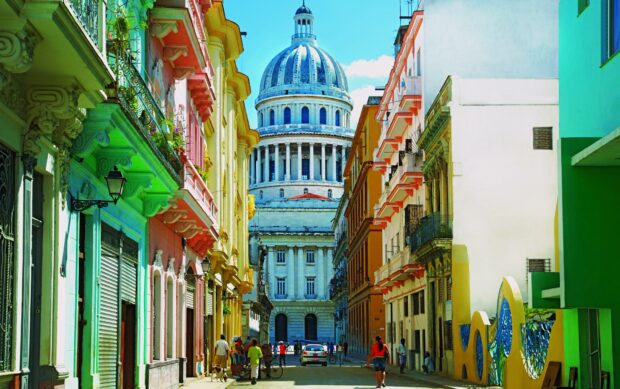 A vibrant street scene features colorful buildings and the Capitol building in Havana Cuba, HD Desktop Wallpaper