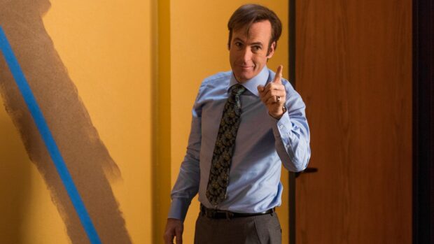 Bob Odenkirk is pointing and smiling in a formal outfit, HD Desktop Wallpaper