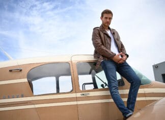 A confident man wearing a leather jacket stands next to a small private plane, The Bachelor Tv Series Wallpapers, 2K Desktop Wallpaper