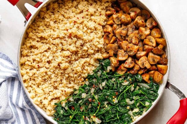 A skillet filled with cooked quinoa, sautéed mushrooms, and spinach seasoned with spices, HD Desktop Wallpaper