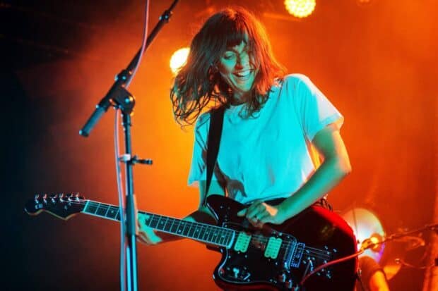 Courtney Barnett wallpapers captures her energized performance with vivid stage lighting, HD Desktop Wallpaper