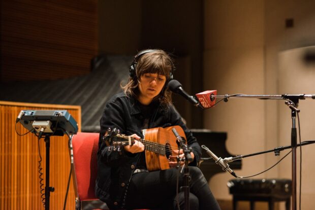 Courtney Barnett wallpapers shows a musician focused on guitar in a recording studio, HD Desktop Wallpaper