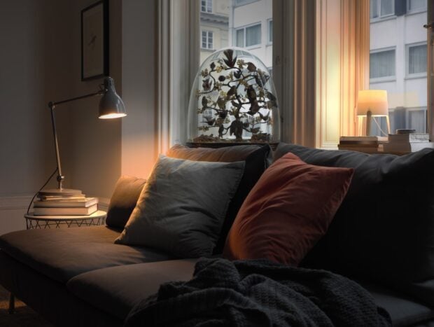The Ikea wallpapers feature a comfortable sofa with various cushions and ambient lighting in a living room setting, HD Desktop Wallpaper