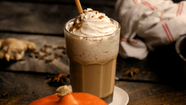 A creamy milkshake topped with whipped cream and cinnamon spice, HD Desktop Wallpaper