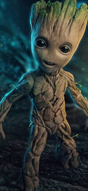 A detailed character of Groot is standing in a dark forest with glowing blue lights around, HD Mobile Wallpaper