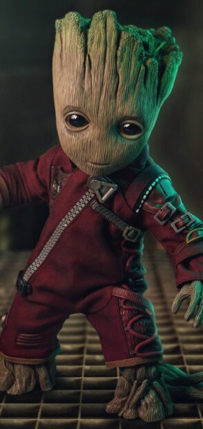 A detailed Groot figure is standing with a focused look wearing a red suit, 2K Phone Wallpaper