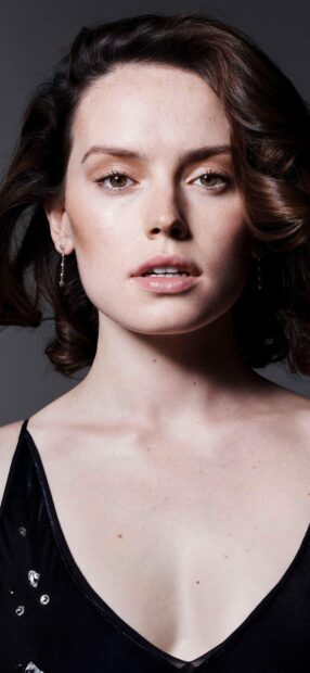 A close up portrait of Daisy Ridley with minimal makeup and curled hair, HD Mobile Wallpaper