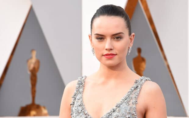 Daisy Ridley wears a silver dress and elegant earrings at a formal event, HD Desktop Wallpaper
