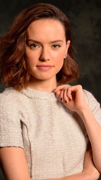 A close up portrait of Daisy Ridley with a calm expression and a textured light dress, 4K Phone Wallpaper