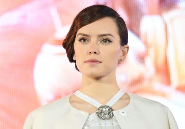Daisy Ridley looks ahead with a soft expression during a public event, 2K Desktop Wallpaper