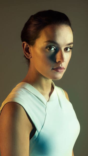 Daisy Ridley wallpapers shows a close up portrait with soft lighting and calm expression, 4K Phone Wallpaper