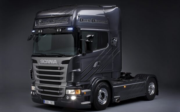 A black Scania truck with Dark Diamond branding is shown in a studio setting, 2K Desktop Wallpaper
