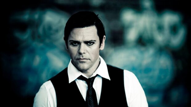 A close up of a Rammstein member with intense expression and dark makeup, HD Desktop Wallpaper