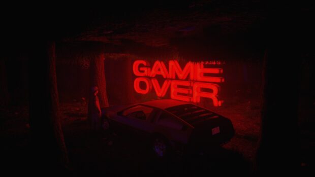 A person stands next to a car under trees with a glowing red game over sign, HD Desktop Wallpaper