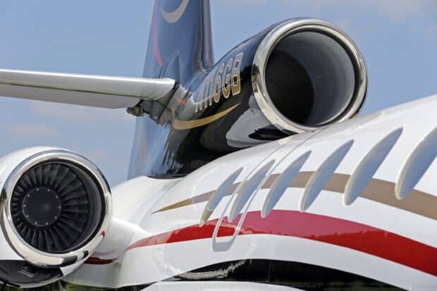 The close up view of Dassault Falcon 50 jet engines shows the aircraft's polished exterior and design, 2K Desktop Wallpaper