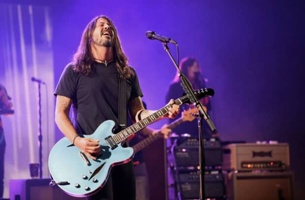 Dave Grohl is passionately playing guitar during a live rock concert, HD Desktop Wallpaper