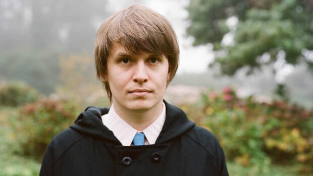 A close up of Death Cab For Cutie in an outdoor setting with greenery, HD Desktop Wallpaper