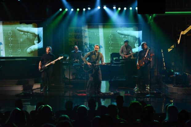 The band Death Cab For Cutie performs on stage with instruments and lights, 2K Desktop Wallpaper