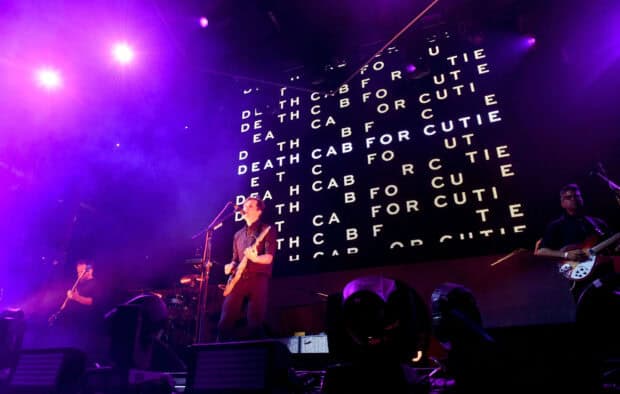 Death Cab For Cutie performing under purple lights at a live concert, HD Desktop Wallpaper