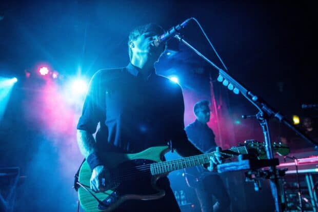 A musician is playing guitar during a Death Cab For Cutie concert, 2K Desktop Wallpaper