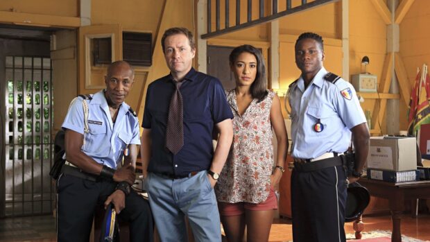 The cast of Death In Paradise TV Series poses together in an office room, HD Desktop Wallpaper