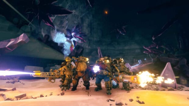 A group of dwarves is fighting inside a dark cave in Deep Rock Galactic with weapons blazing, HD Desktop Wallpaper