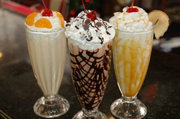 Three milkshakes with whipped cream and cherries are served, 2K Desktop Wallpaper