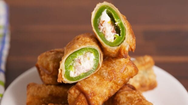 A close up of a jalapeno stuffed with cream cheese and wrapped in crispy fried dough, HD Desktop Wallpaper