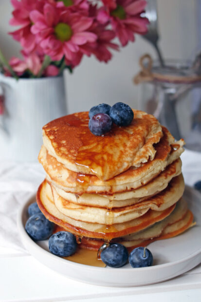 A stack of pancakes topped with blueberries and honey dripping down the sides, HD Mobile Wallpaper