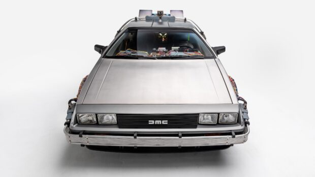 A front view of the Delorean DMC 12 shows its unique design and exposed internal components, 4K Desktop Wallpaper