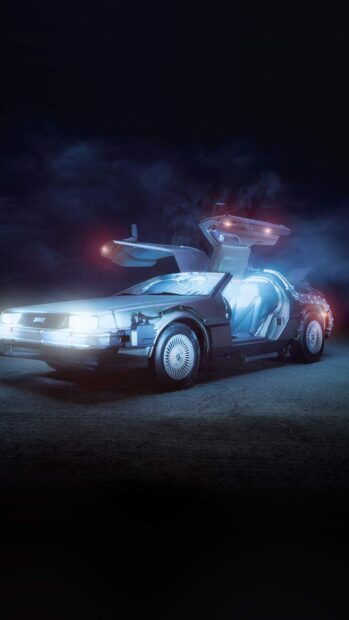 A Delorean DMC 12 is shown with its gullwing doors open and glowing lights at night, HD Mobile Wallpaper