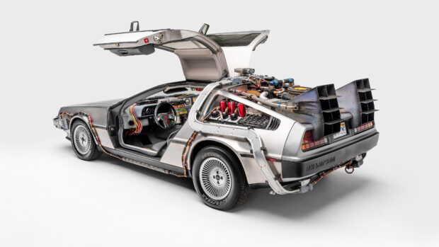 A silver Delorean Dmc 12 with an open gullwing door and detailed rear modifications, 4K Desktop Wallpaper