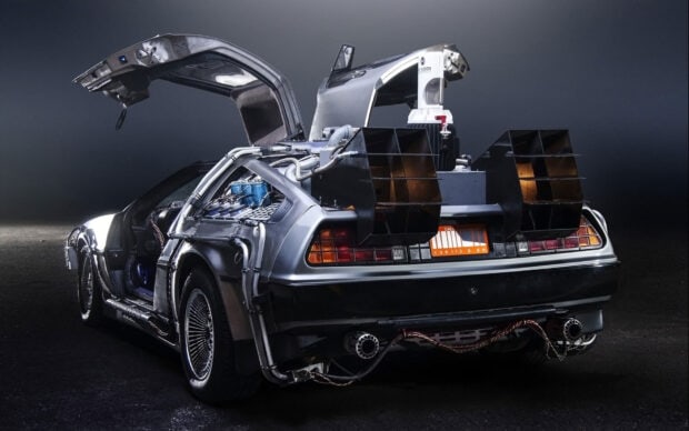 A silver Delorean Dmc 12 with gull wing door open and detailed rear design, HD Desktop Wallpaper