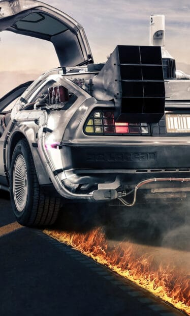 Delorean Dmc 12 speeding with flaming tires on the road at sunset, HD Mobile Wallpaper