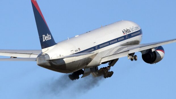 A Delta Air Lines plane is seen taking off with its landing gear retracting into the sky, 4K Desktop Wallpaper