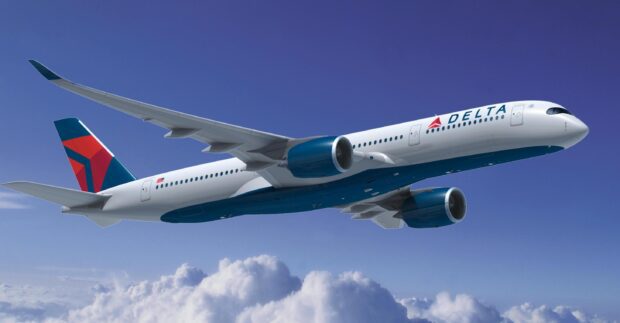 A Delta Air Lines airplane is flying above clouds with a clear blue sky, 2K Desktop Wallpaper