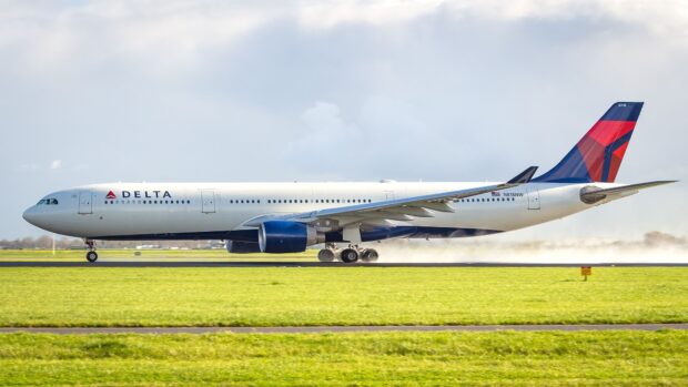 A Delta Air Lines airplane is taxiing on the runway with its landing gears down, HD Desktop Wallpaper