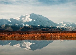 Snowy peaks reflect on calm water in Denali National Park And Preserve, HD Desktop Wallpaper