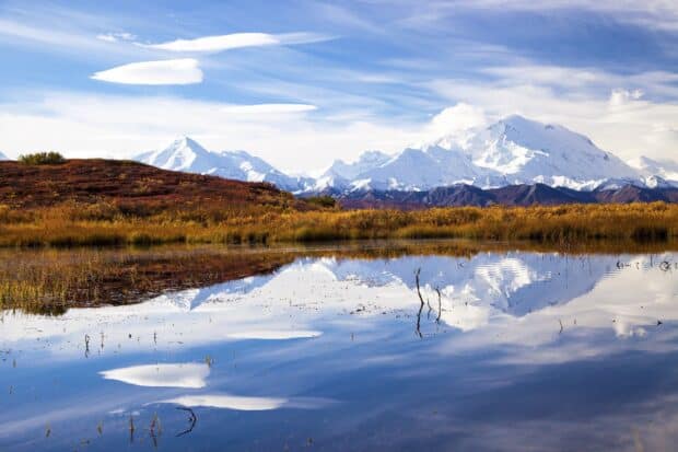 Snowy mountains reflect in still water under blue sky, HD Desktop Wallpaper